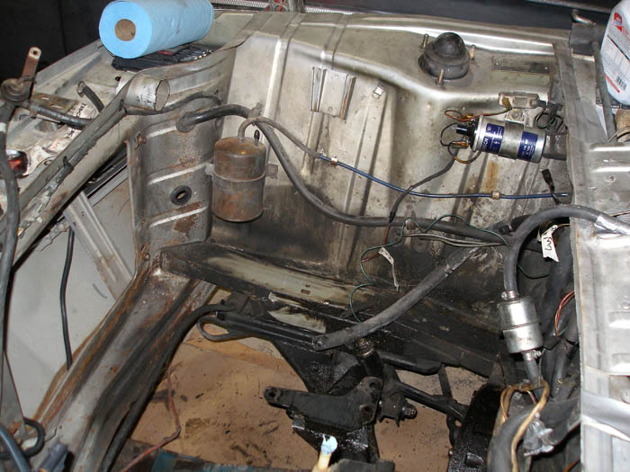 Image:Empty engine bay being cleaned.JPG